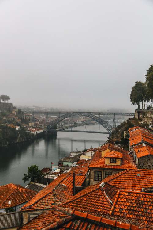 Traditional Roofs And Modern Bridge Photo