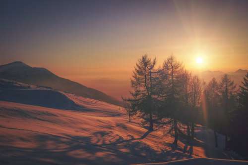Winter Sun On Snowy Mountain Photo