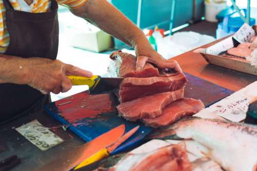 Portioning tuna at fish market