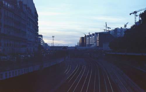 train tracks city dusk night