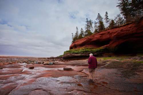 rocky coastal landscape man walking