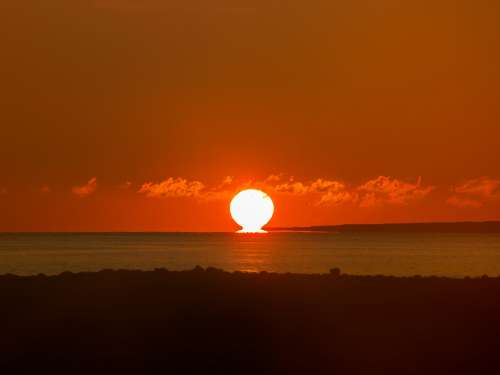 Deep Red Sunset On The Horizon Photo
