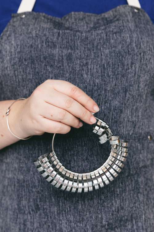 Jeweler Holds Ring-sizer Photo