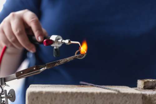 Shaping A Ring With Fire Photo