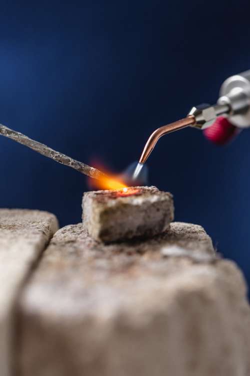 Heating Metal With Blowtorch Photo