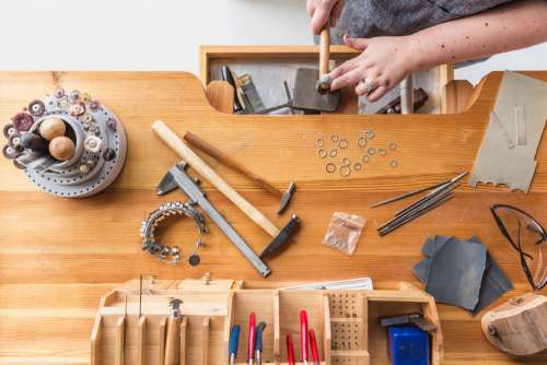 Jeweler Working At Workbench Photo