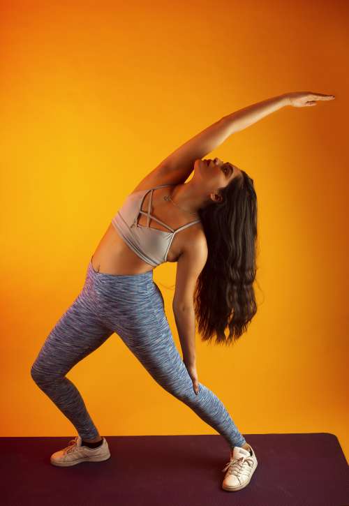 Woman Stretching On Yoga Mat Photo