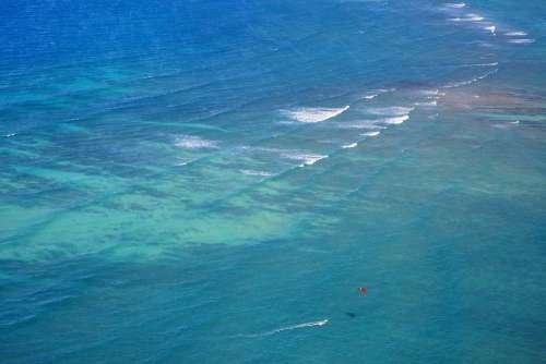 Red Kite On Blue Ocean Photo