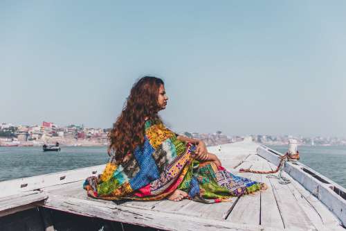 Pondering Woman In Boat Photo