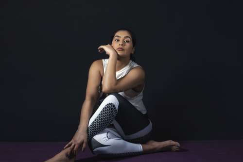 Woman Chills On Yoga Mat Photo