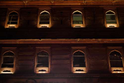 Illuminated Windows At Night Photo