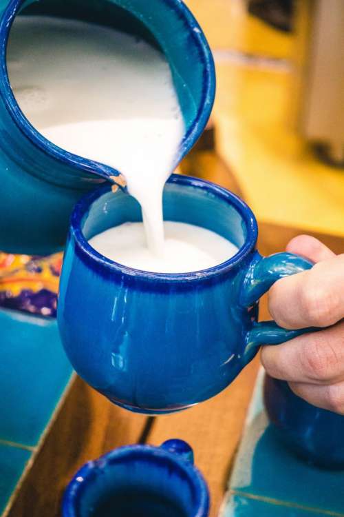 Pouring traditional Iranian yogurt drink Doogh