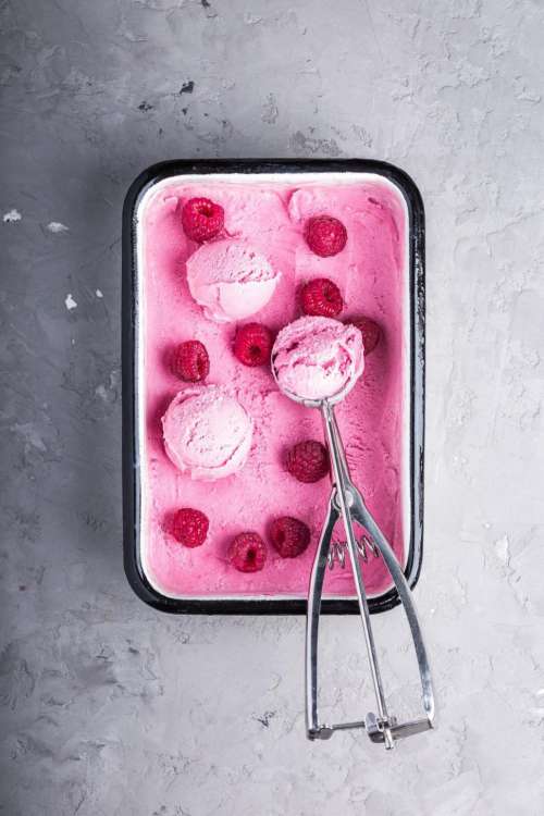 Overhead view of a raspberry ice cream container