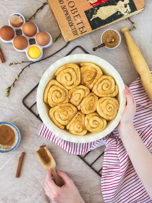 Overhead view of cinnamon buns in a baking pot