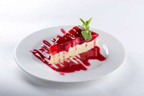 Cake garnished with strawberry sauce
