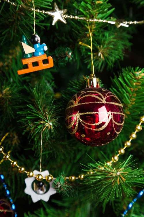 Close up of a bauble hanging on the Christmas tree