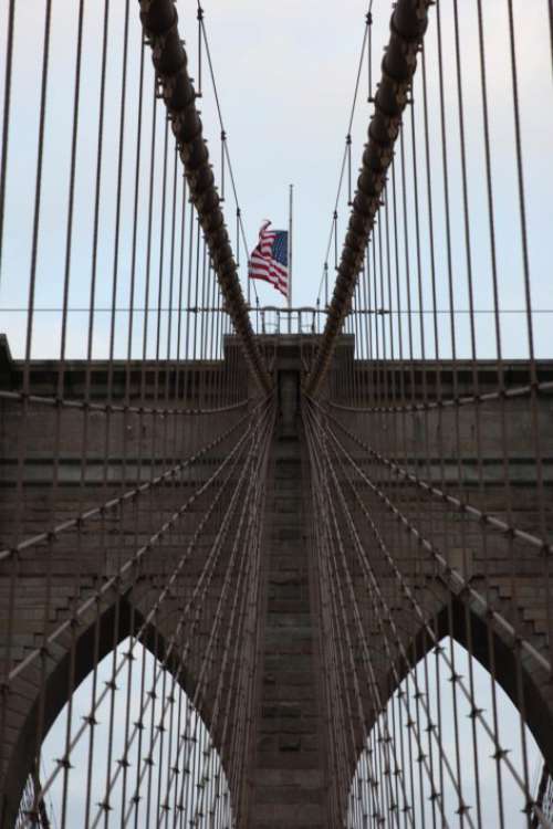 Flag on bridge Free Photo