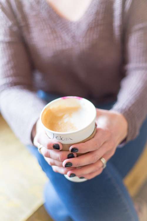 holding coffee cup woman female