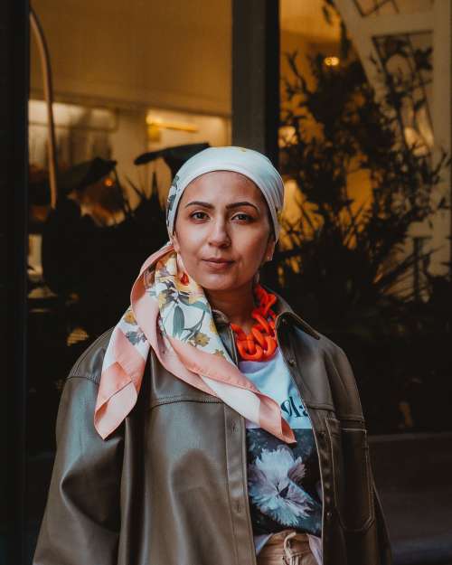Woman Wearing Headscarf Looks Into Lens Photo