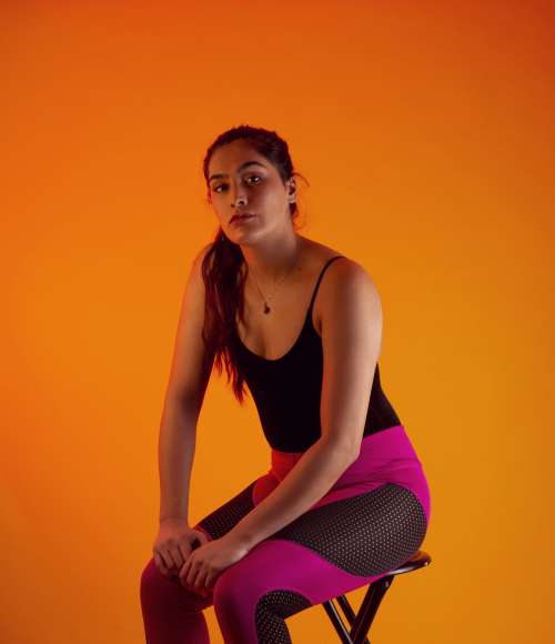 Woman Wearing Pink and Black Fitness Clothing Photo