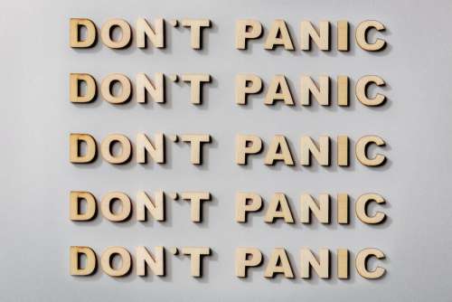 Don't Panic Statement In Wooden Letters Photo