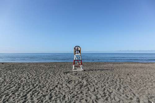 Empty Lifeguard Chair At The Beach Photo