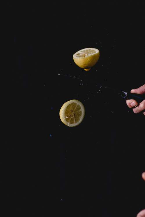 Slicing A Lemon In Half Photo