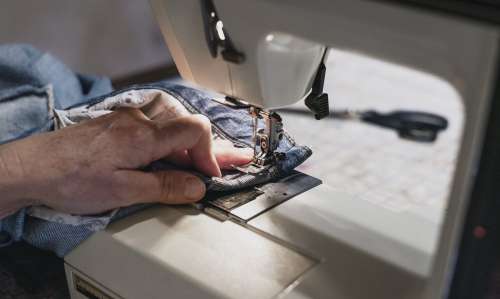 Denim Runs Through Sewing Machine Photo