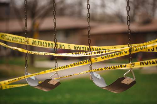 Swings Wrapped With Caution Tape Photo
