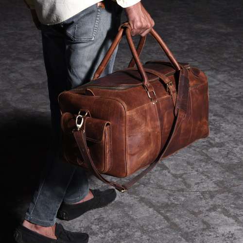 Man Walking With A Leather Travel Bag. Photo