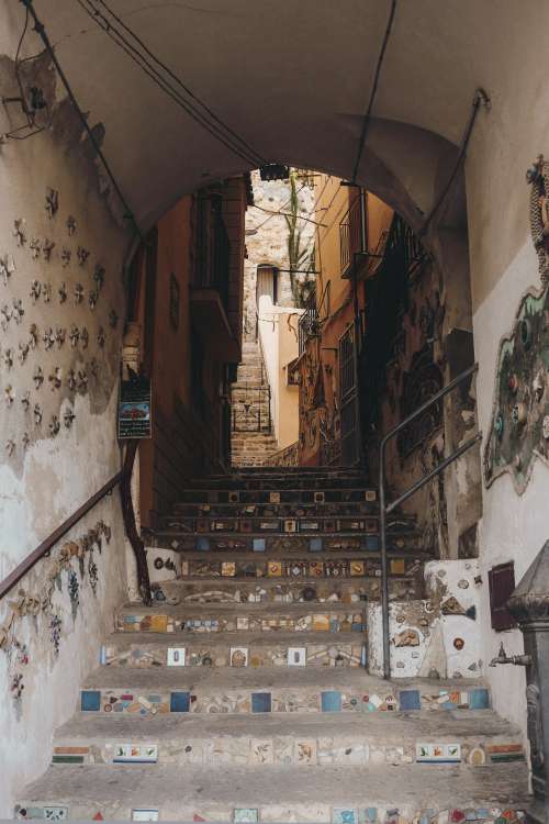 Staircase In An Arched Tunnel With Mosaic Deatils Photo