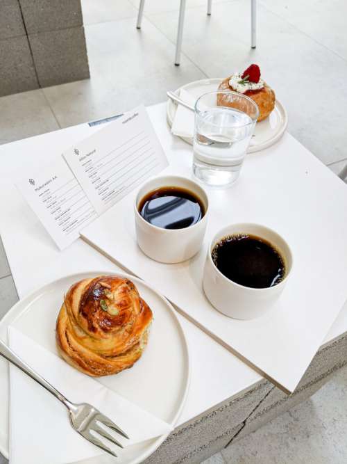 Coffee break with small sweet pastry