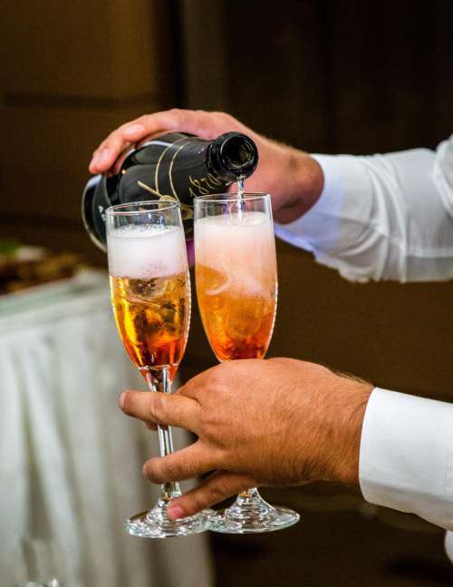 Close up of champagne being poured into glasses