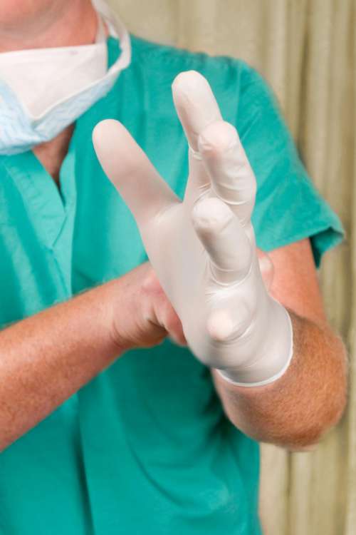 Medical Provider Putting on Gloves