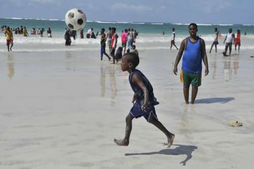 children, kids, son, boy, play, leisure, game, happiness, enjoyment, facial expression, football, fun, entertainment, beach soccer, shore, water, man, father, people, family