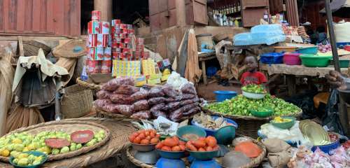 market, sale, stall, marketplace, merchant, booth, shopping, commerce, local, people, child, facial expression, canned food, market
