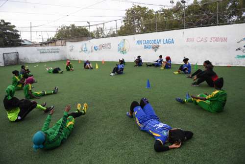 woman, people, footballer, training, stretching, exhaustion, sports ground, green lawn, players, soccer field, warmup exercises