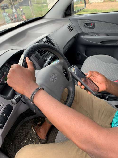 people, handling portable, steering wheel, car, smartphone, driver, road trip, road safety, phone user