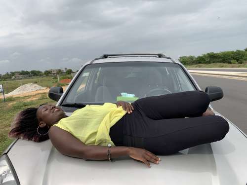 car, woman, lying, people, facial expression, parked, tired, rest, break, pose, posture, model, road trip