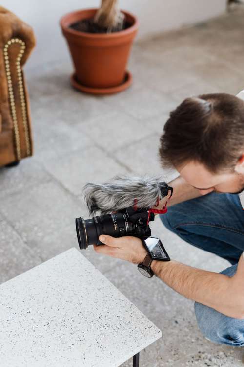 Filmmaker with DSLR Camera Taking Shoots