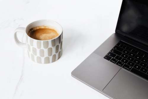 A cup of coffee on white marble