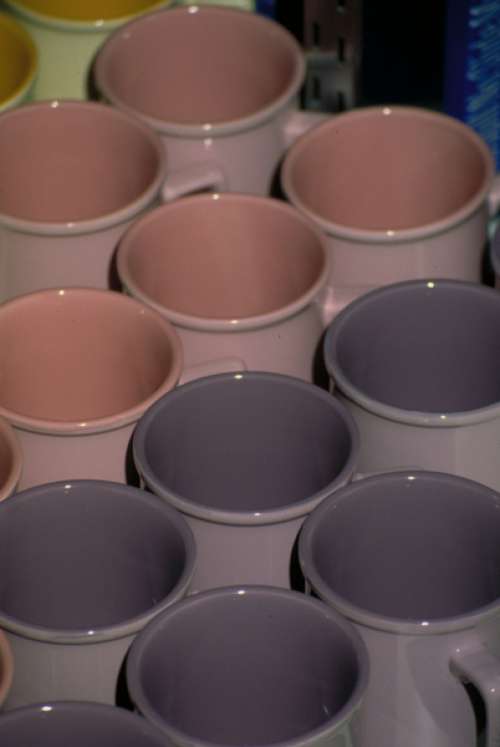 Rows of ceramic mugs