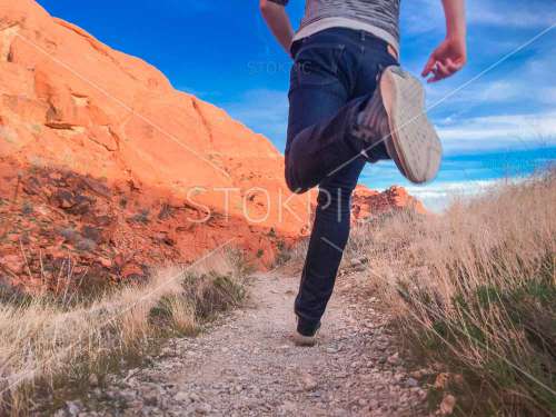 Free fitness photos of Man Running Outside Along Desert Trail