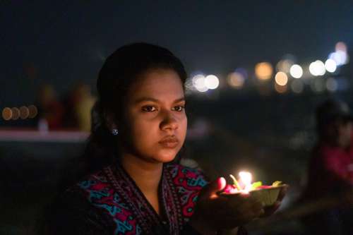 Woman Holds Candle Photo