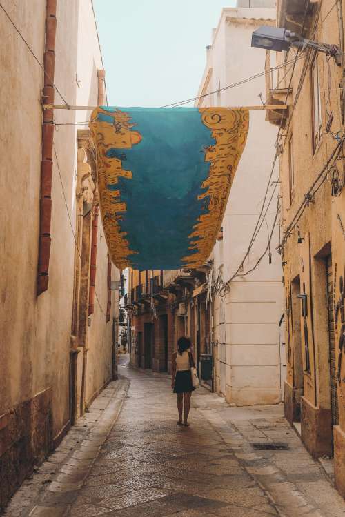 Woman Walking Down The Street Photo