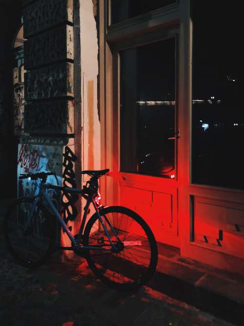 Bike Leaning Against A Building Photo
