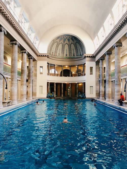 Swimming Pool With Ornate Ceiling And Columns Photo