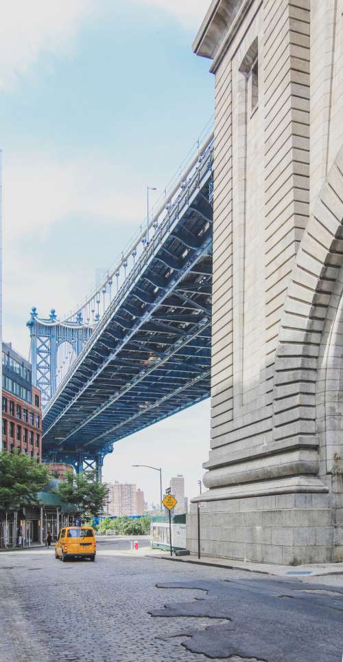 New York Taxi Under Brooklyn Bridge Photo