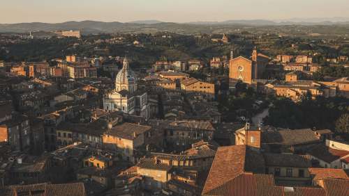 Sunsetting Over Town With Terracotta Roofs Photo