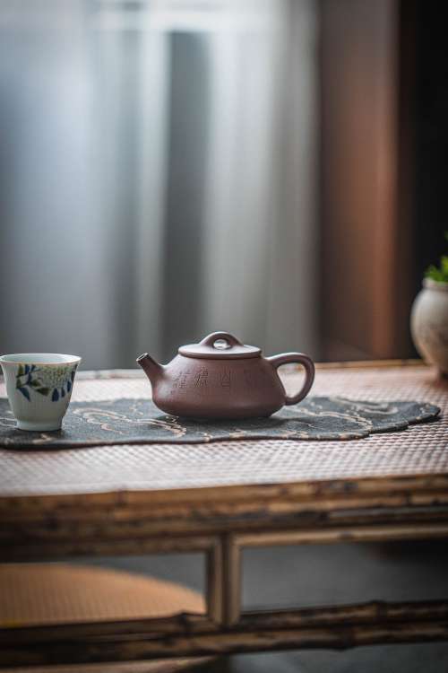 Clay Teapot And Teacup On The Table Photo